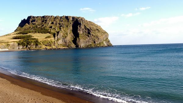 Beautiful Pics of the Sea - The Blue and Clear Sea, a Green Hill in the Middle, Yellow Sand by Beach