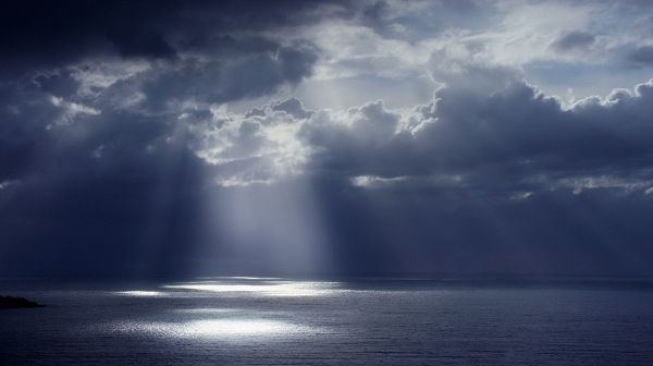 Beautiful Scene of Nature - The Dark and Cloudy Sky, Sunlight Breaking Through, the Peaceful Sea, Great in Look