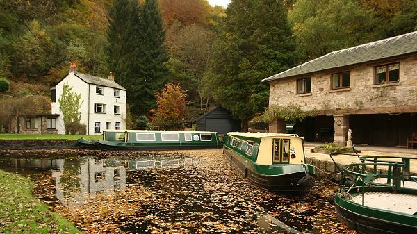 Free Download Natural Scenery Picture - Two Boats in Stop, Green and Natural Plants Alongside, Seemingly Empty Houses