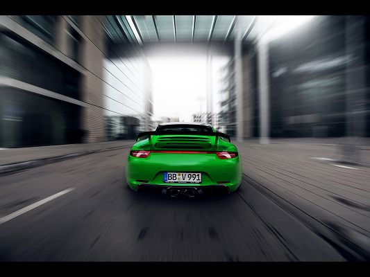 Images of Super Car, Green Porsche 911 in the Sun, Seen from Back and Surrounding Scene, Speed is Incredible