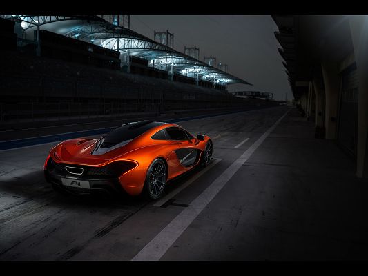 Super Cars Image of McLaren P1, an Orange Car on Black Road, It is Like a Monster at Night
