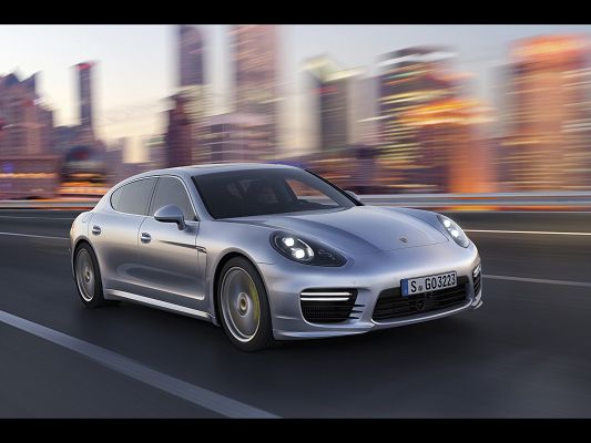 Top Car Photos of Porsche Panamera, a Great Car in the Run, Surrounding Scenes Are Rushing Behind