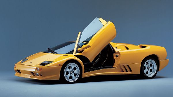 Yellow Lamborghini Car with Doors Open, They Are Like Stretched out Wings, Driving is Like Flying, a Super Car - HD Cars Wallpaper
