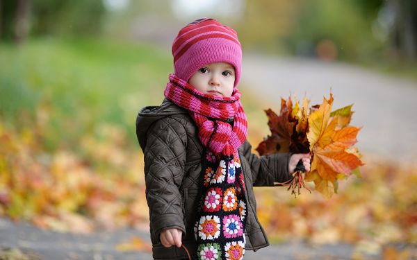 Wallpaper Of Babies: A Cute Baby In Autumn With Yellow Leaves