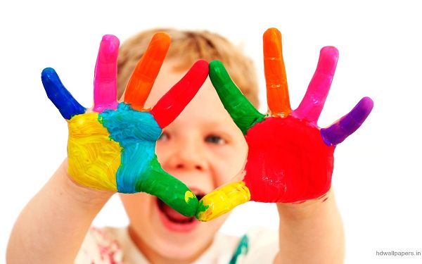 Wallpaper Of Baby-a Cute Boy With Colorful Fingers