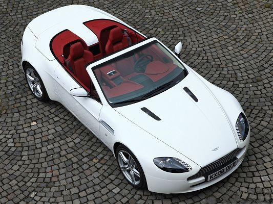 click to free download the wallpaper--Aston Martin Car Wallpaper, White and Decent Car in Stop, Gray Bricks
