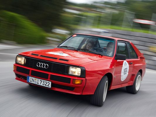 click to free download the wallpaper--Audi Sport Quattro Car, Red Super Car in the Run, About to Turn a Corner