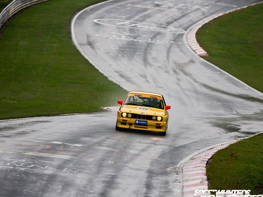 click to free download the wallpaper--BMW Car Wallpaper, Yellow Car in the Run, Crooked Roads