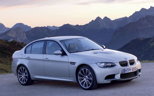 click to free download the wallpaper--BMW Cars as Wallpaper, Silver Super Car Among Tall and Magnificent Hills