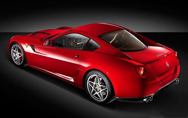 click to free download the wallpaper--Ferrari Cars Wallpaper, Red Sport Car with Glowing Body, Dark Background