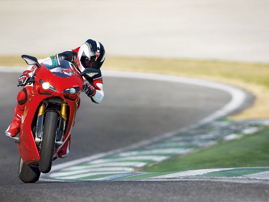 click to free download the wallpaper--Free Car Wallpapers, Ducati 1198 Superbike Turning a Corner, Front Wheels Up