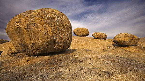 Free Download Natural Scenery Picture - Four Stones in Different Sizes, Under the Blue Sky, Everything is Simplified