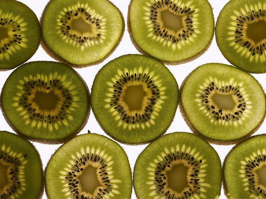 click to free download the wallpaper--Free Fruit Wallpaper, Kiwis Cut into Half, Want a Bite?