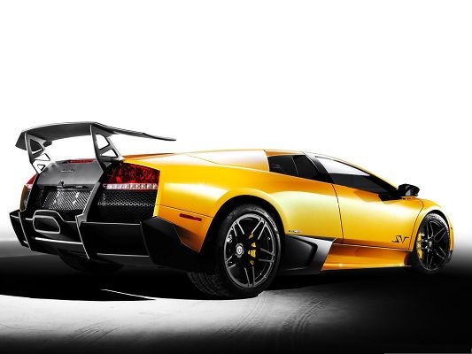 click to free download the wallpaper--Lamborghini Sport Cars, Yellow Supercar in the Run, White Background