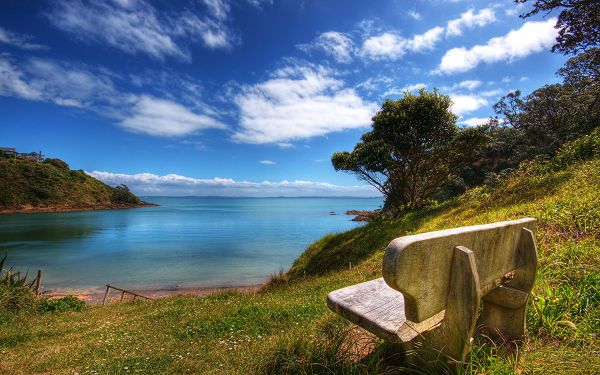 click to free download the wallpaper---Peaceful Sea, Blue Sky and Stone Chair Combined, Must be Comfortable and Relaxing to Sit on - Natural Scenery Wallpaper