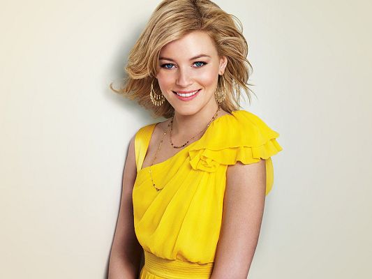 click to free download the wallpaper--Played in Role Models, The Uninvited and The Next Three Days, In Smiling Facial Expression and Yellow Suit, What a Star! - HD Elizabeth Banks Wallpaper