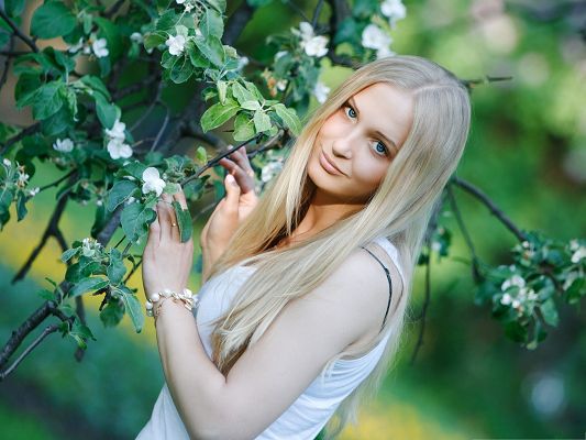 Pretty Girl Pictures, Light Blonde Woman Smiling Among Blooming Flowers