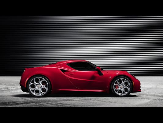click to free download the wallpaper--World-Famous Super Cars Image of Red Alfa Romeo 4C Just Out from Its Garage, Expect Its Speed