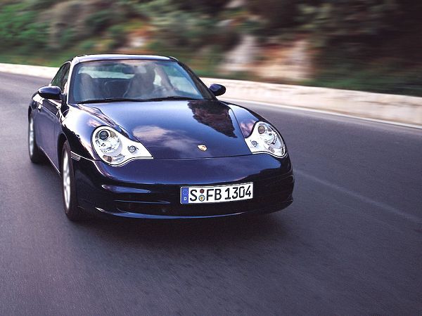 fre wallppaer: a bright blue Porsche running on the road
 ,click to download