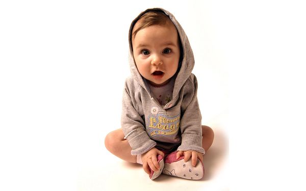 wallpaper of lovely baby: a cute baby boy wearing a light brown sweater ,click to download
