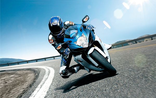 wallpaper of motorcycle: a biker on Suzuki motorcycle ,click to download