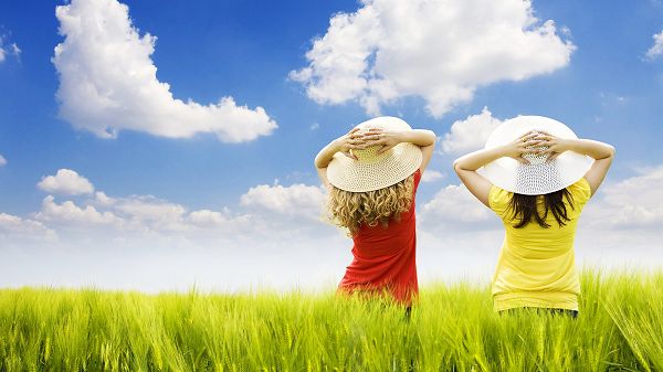 wallpaper of natural scenery: two girls standing in the field ,click to download